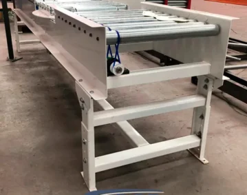 Transportador industrial de rodillos vivos por liga